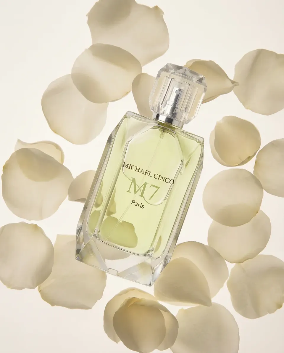 M7 eau de parfum among white rose petals