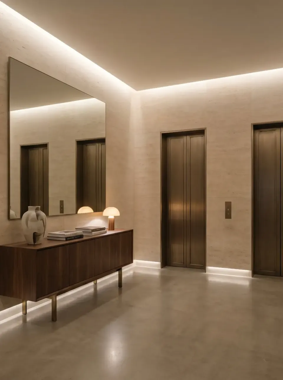 Lift lobby in travertine with a mirrored console