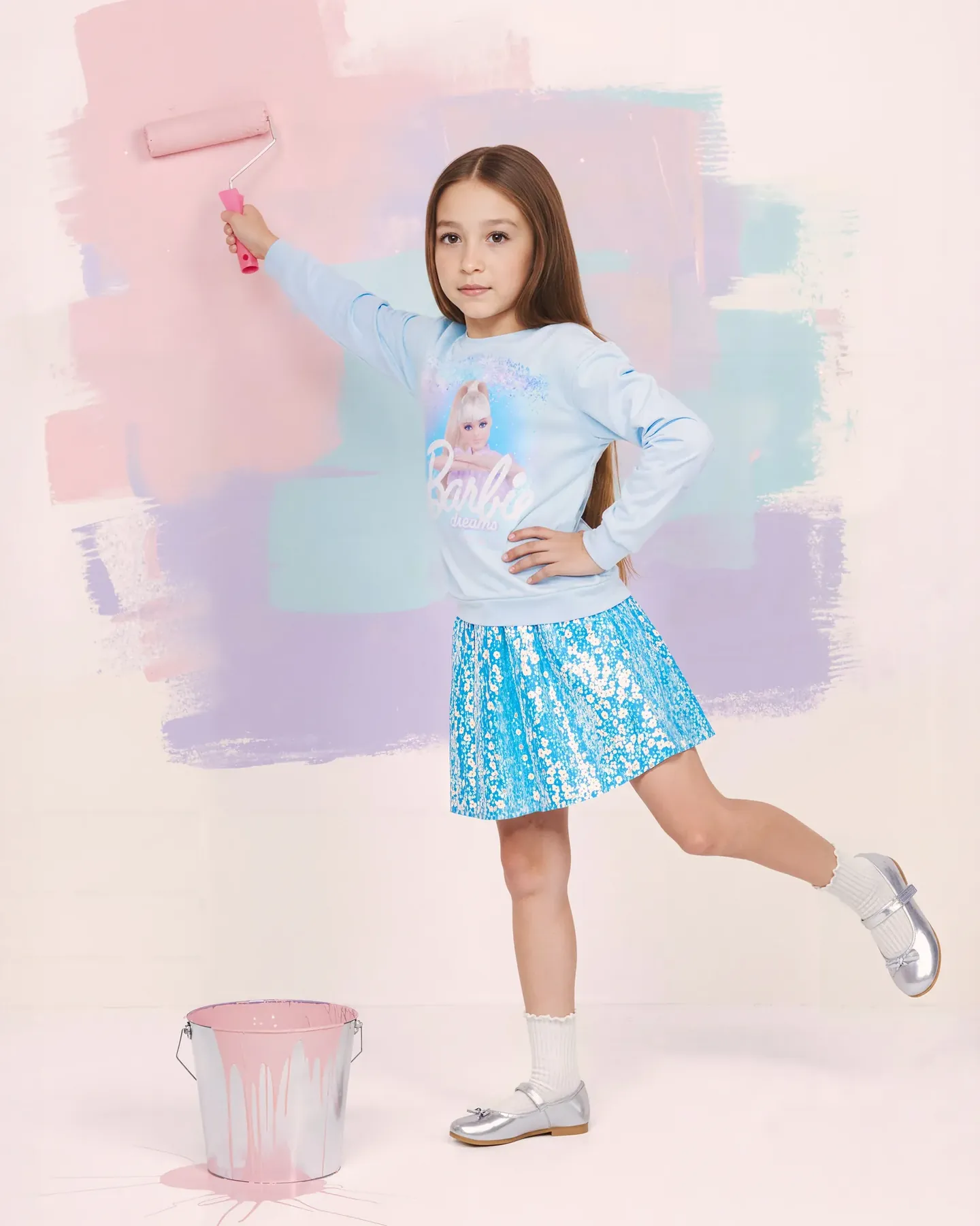 Barbie brunette girl in a blue Barbie Dreams sweatshirt and sequin skirt