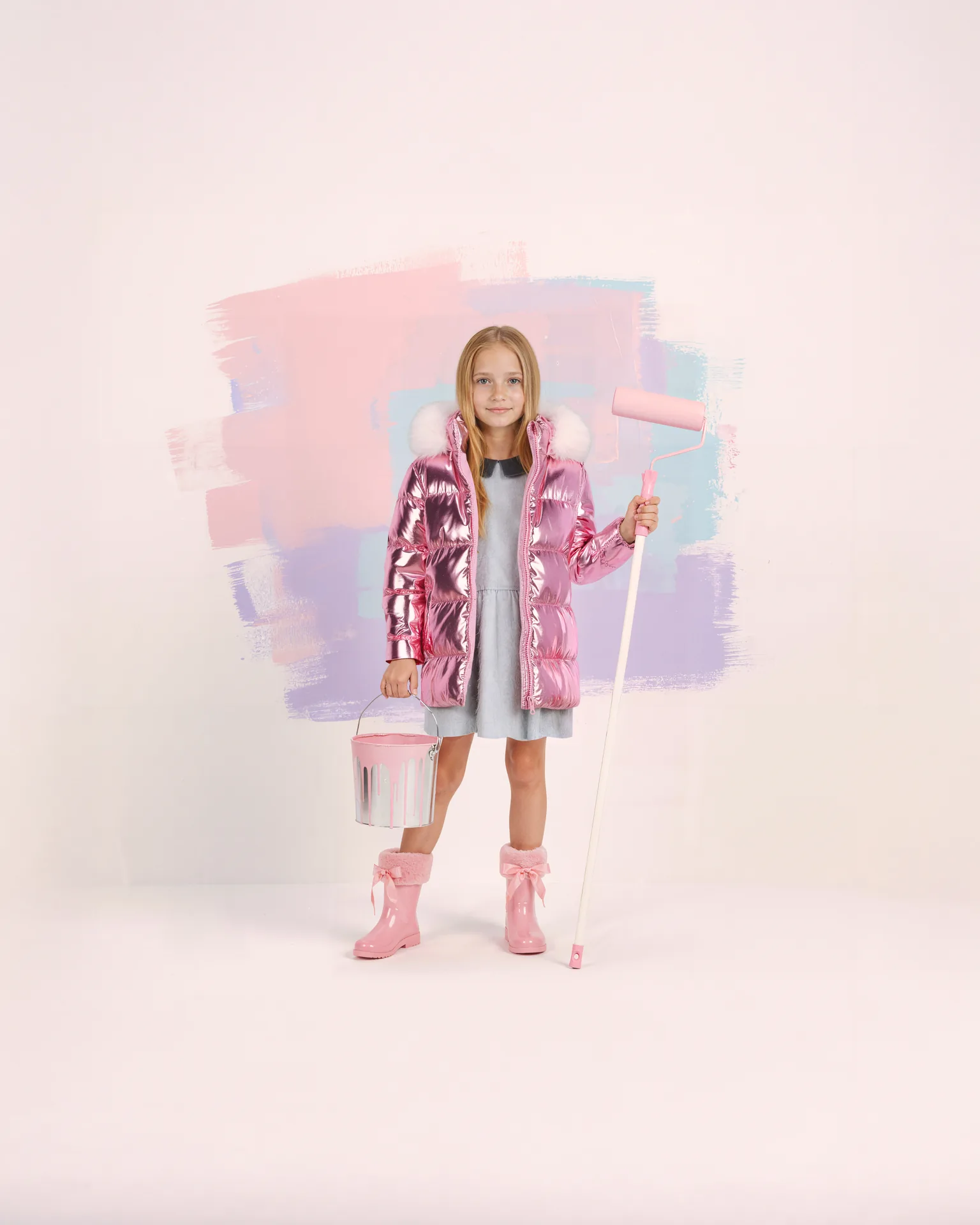 Barbie blonde girl in a pink metallic puffer coat and pink boots