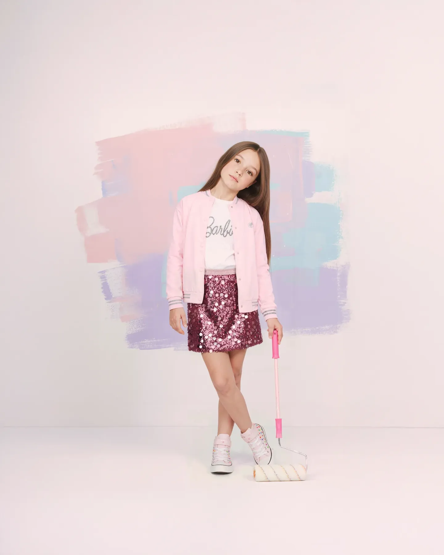 Barbie brunette girl in a pink bomber and sequin skirt