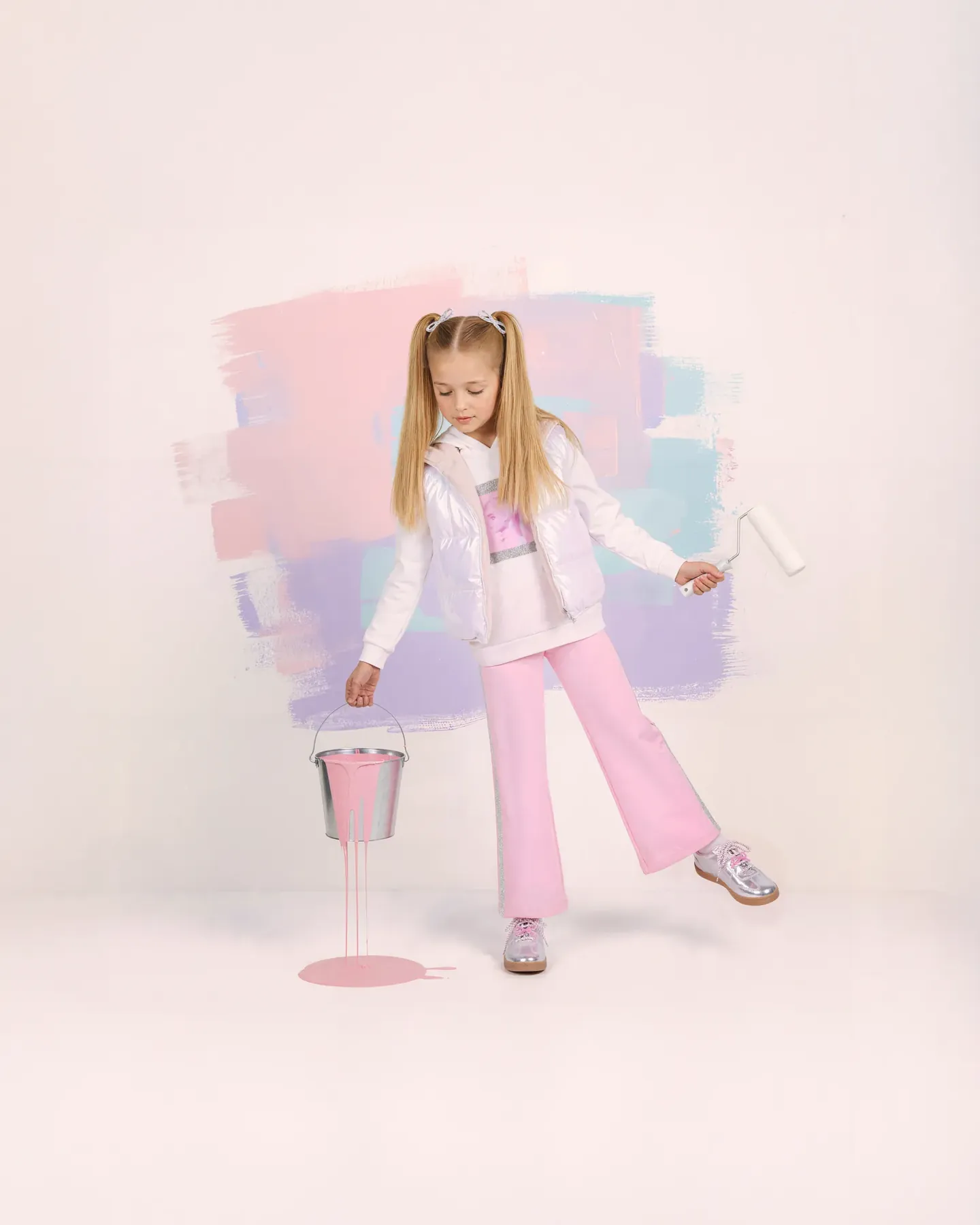 Barbie blonde girl in pigtails, white puffer vest and pink trousers